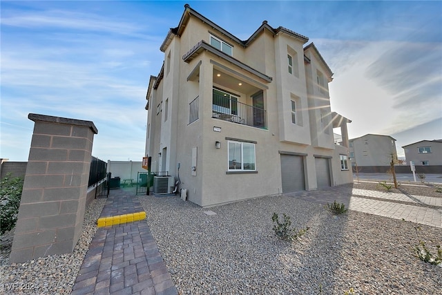 exterior space featuring a garage and central AC unit