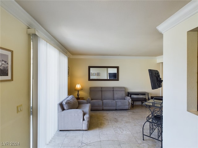 living room featuring ornamental molding and light tile patterned floors