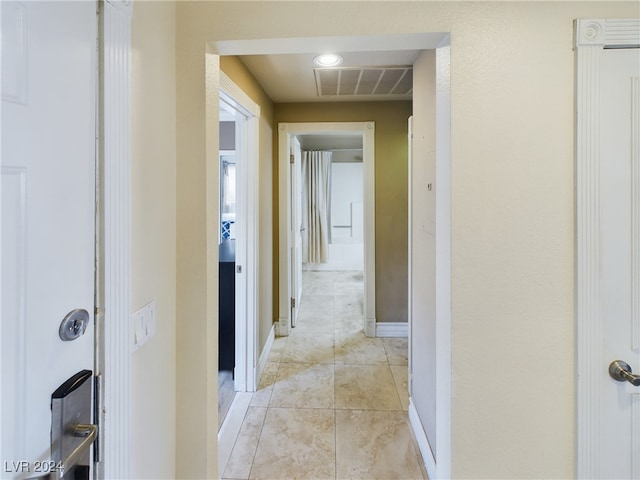 hallway with light tile patterned flooring