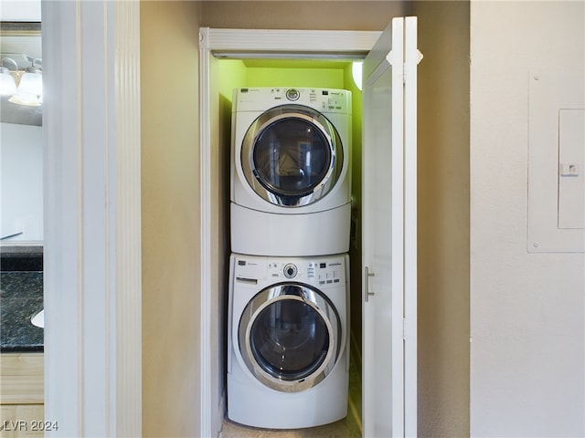 laundry room featuring stacked washing maching and dryer