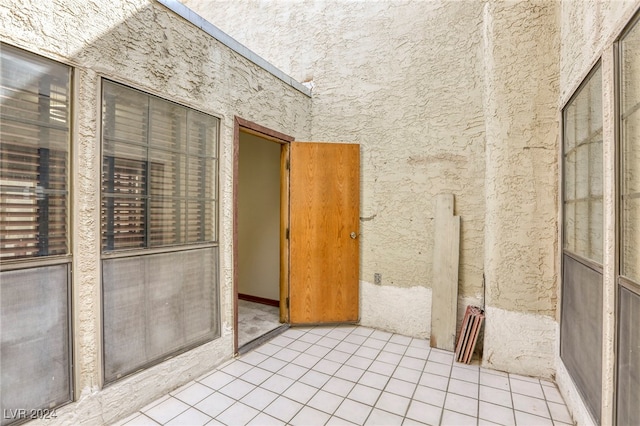 interior space featuring light tile patterned floors