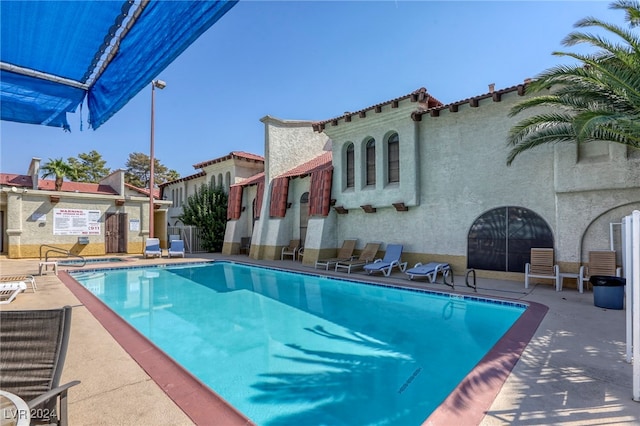 view of pool featuring a patio