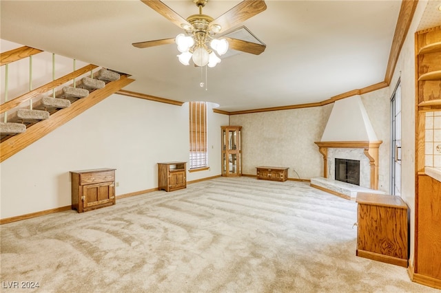 unfurnished living room with a fireplace, ceiling fan, and carpet flooring