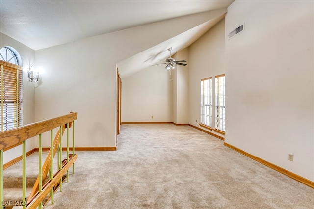 unfurnished room with light carpet, baseboards, visible vents, and a ceiling fan