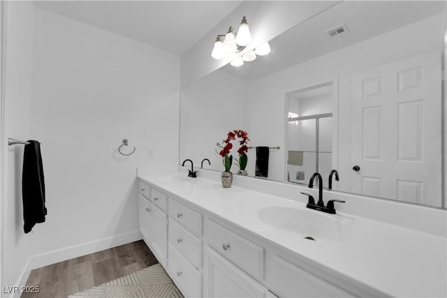 bathroom featuring vanity and wood-type flooring