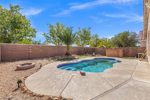 view of swimming pool featuring a fire pit, a patio area, a fenced backyard, and a fenced in pool