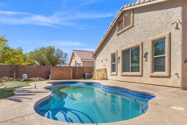 view of swimming pool featuring a fenced in pool and a fenced backyard