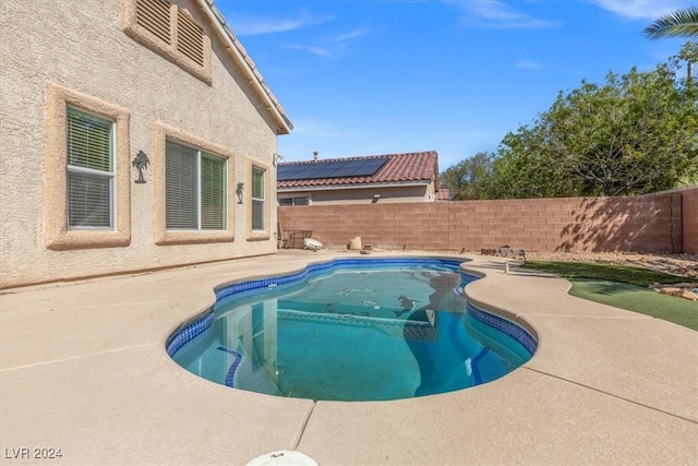 view of swimming pool featuring a patio area, a fenced backyard, and a fenced in pool