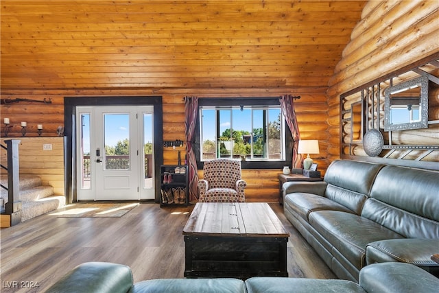 living room with lofted ceiling, log walls, wooden ceiling, and wood-type flooring