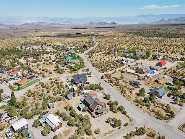 drone / aerial view featuring a mountain view