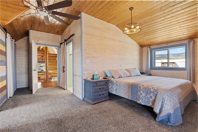 unfurnished bedroom with lofted ceiling, a barn door, ceiling fan with notable chandelier, and wood ceiling