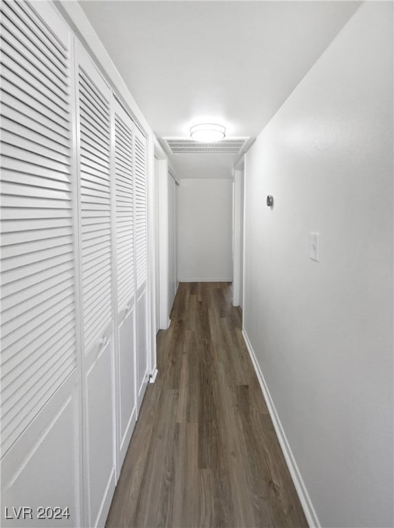 hall with dark wood-type flooring