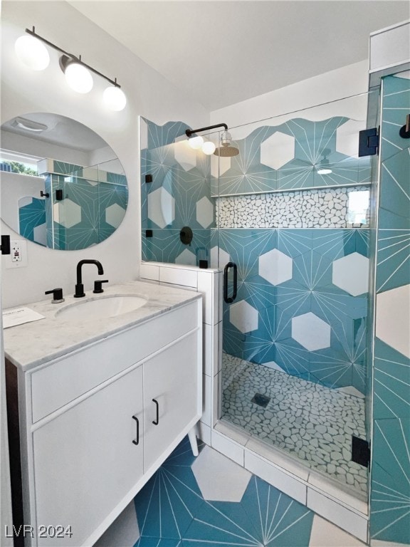 bathroom with vanity, an enclosed shower, and tile patterned flooring