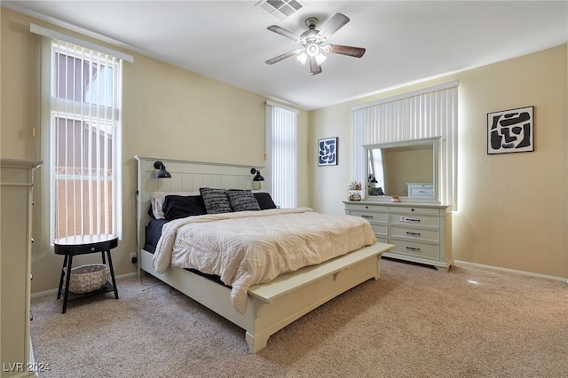 bedroom featuring light colored carpet and ceiling fan