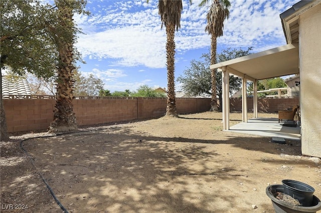 view of yard featuring a fenced backyard and a patio area