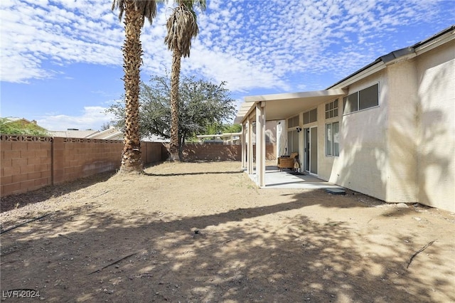 view of yard with a fenced backyard and a patio area