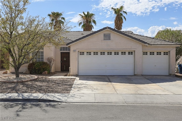 single story home featuring a garage