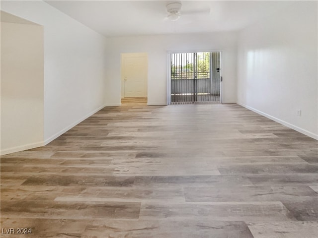 spare room with ceiling fan and light hardwood / wood-style floors