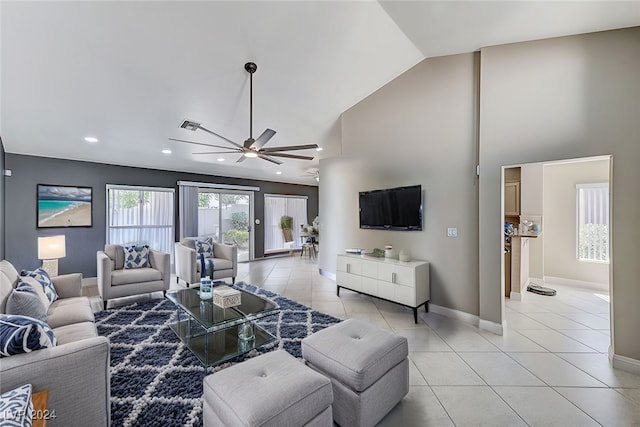 tiled living room with high vaulted ceiling and ceiling fan