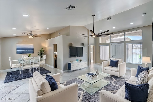 living room with ceiling fan and high vaulted ceiling