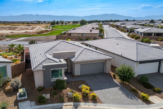 birds eye view of property with a mountain view