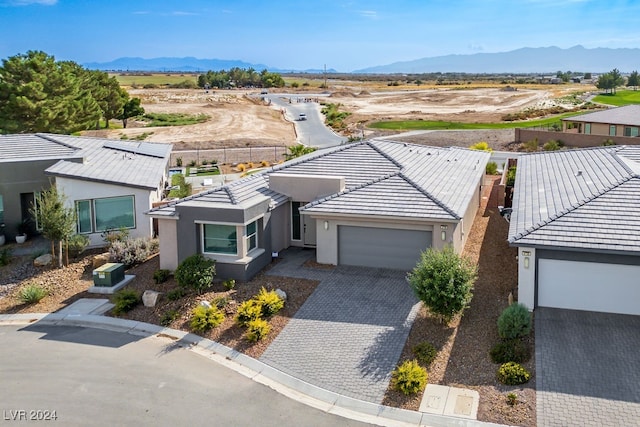 drone / aerial view featuring a mountain view