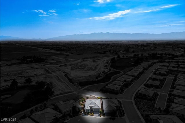 birds eye view of property featuring a mountain view