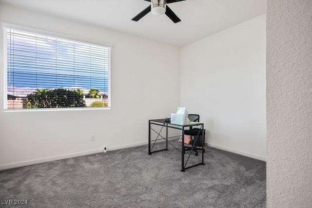 carpeted office with ceiling fan and vaulted ceiling