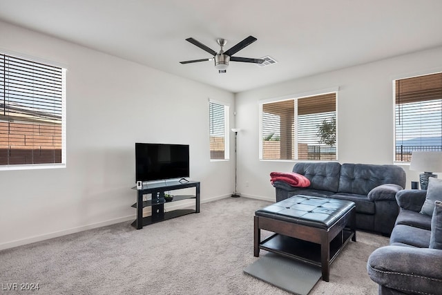 carpeted living room featuring ceiling fan