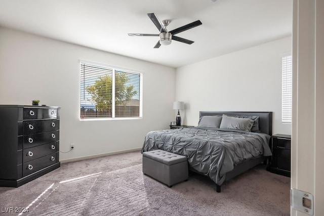 bedroom with ceiling fan and carpet floors