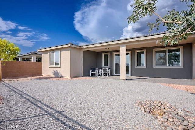 back of property featuring a patio area