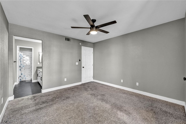 carpeted empty room featuring ceiling fan