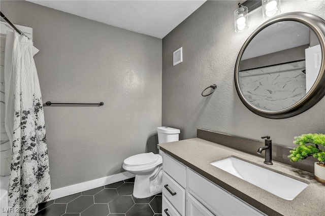 bathroom featuring vanity, toilet, curtained shower, and tile patterned floors