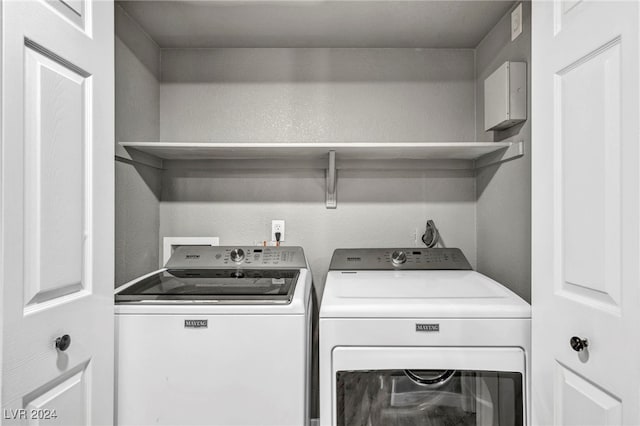 laundry area with separate washer and dryer