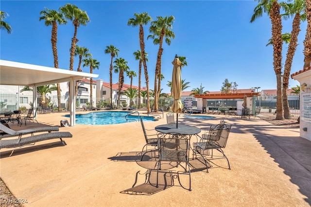 view of swimming pool featuring a patio area