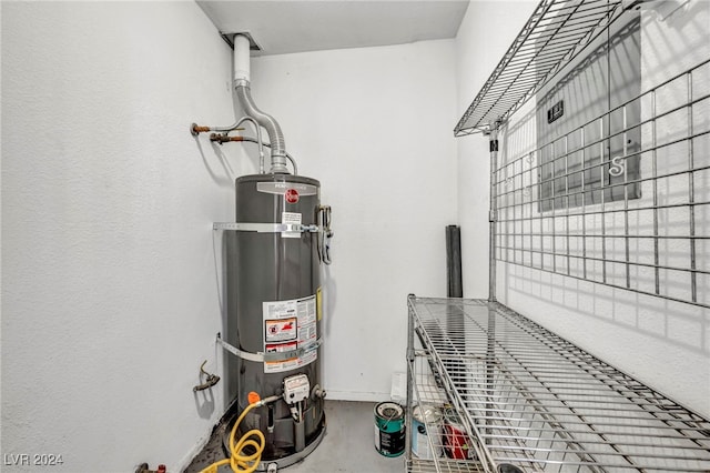 utility room with strapped water heater