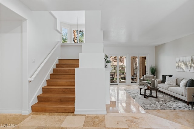 stairway with an inviting chandelier