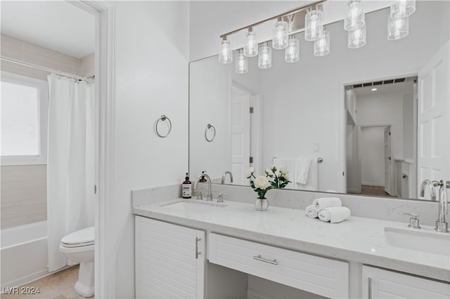 full bathroom featuring vanity, tile patterned flooring, toilet, and shower / bath combo