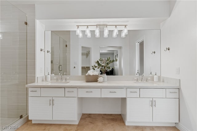 bathroom with walk in shower and vanity