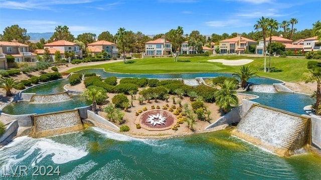 surrounding community featuring a water view