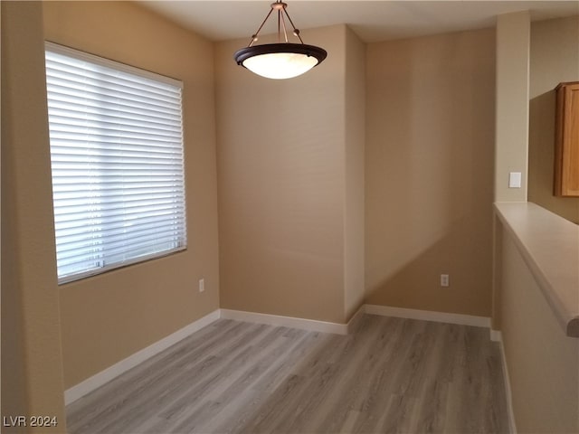 empty room with hardwood / wood-style floors