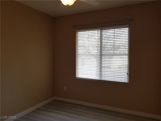 spare room with ceiling fan and hardwood / wood-style floors