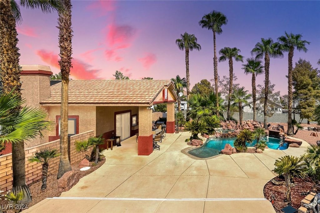 view of swimming pool with fence, a fenced in pool, and a patio