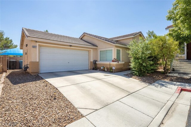 single story home featuring a garage