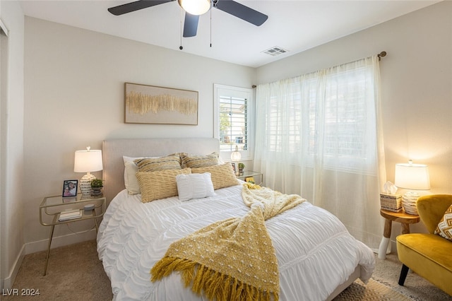 carpeted bedroom with ceiling fan