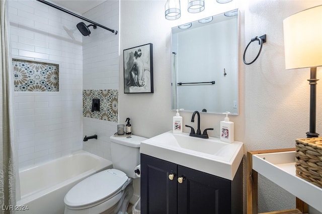 full bathroom with vanity, toilet, and tiled shower / bath combo