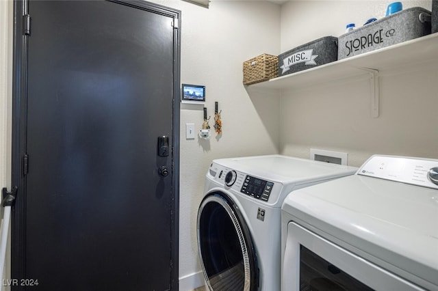 laundry room featuring washing machine and dryer