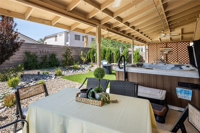 view of patio with a hot tub and an outdoor hangout area