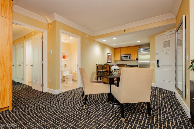 dining area featuring dark colored carpet