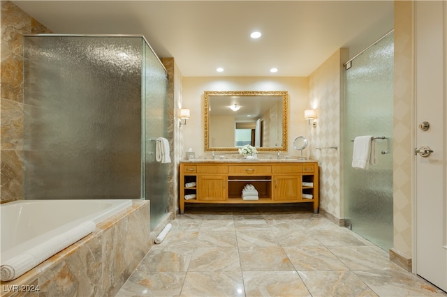 bathroom with vanity and plus walk in shower